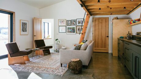 Living, dining, and kitchen area of a net-zero home