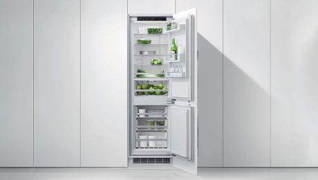Open fridge amongst concealed cabinets